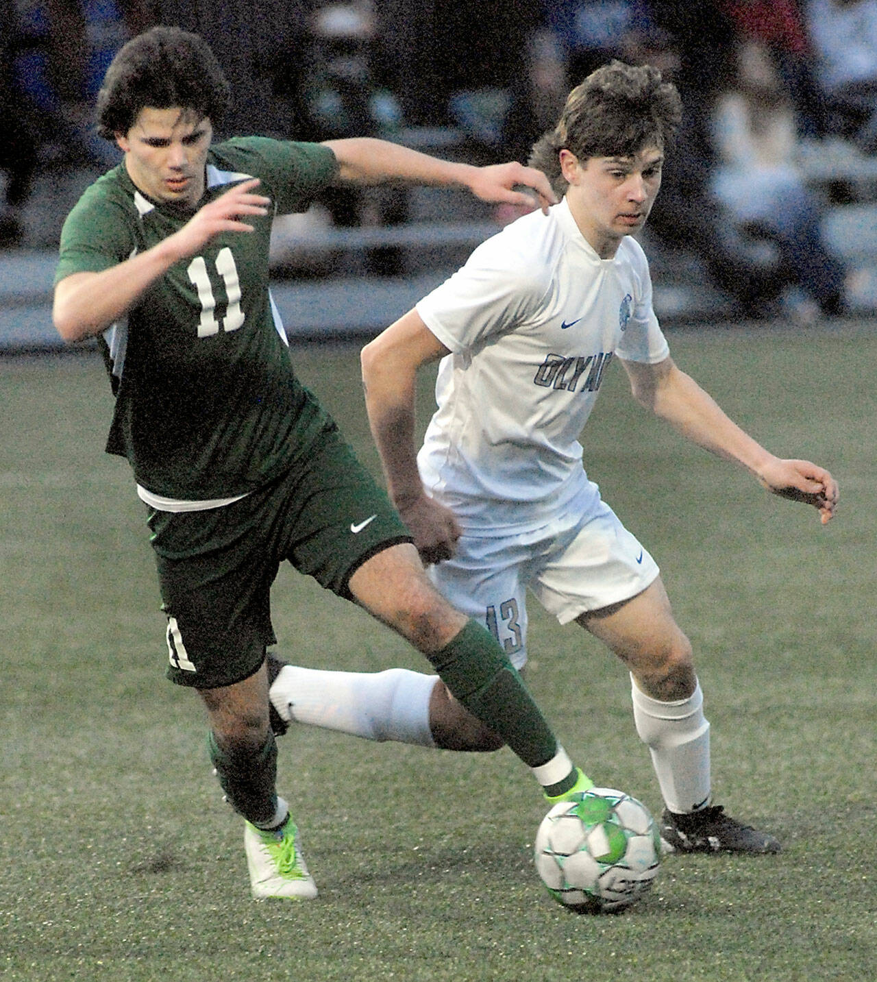 Keith Thorpe/Peninsula Daily News Port Angeles Xander Maestas, left, dribbles past Olympics Justin Thorsen on Thursday evening at Peninsula College in Port Angeles.