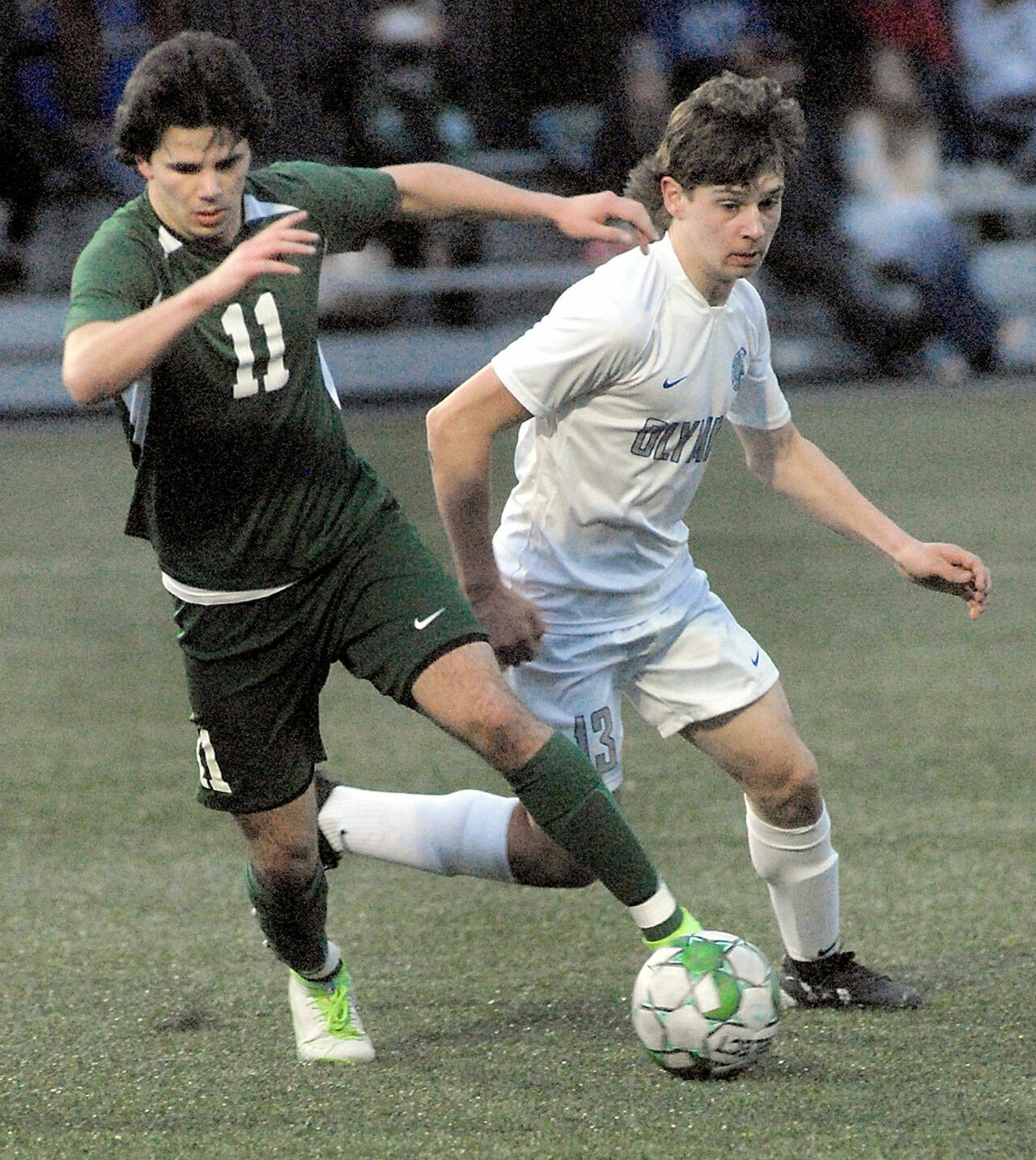 Keith Thorpe/Peninsula Daily News Port Angeles’ Xander Maestas, left, dribbles past Olympic’s Justin Thorsen on Thursday evening at Peninsula College in Port Angeles.