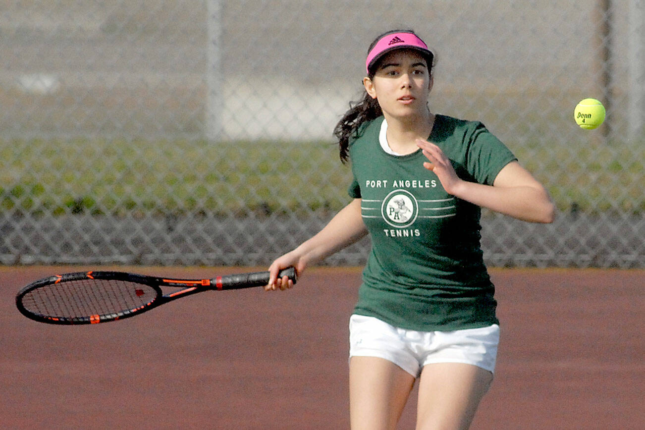 Keith Thorpe/Peninsula Daily News
Port Angeles' Liberty Lauer approches the ball in her singles match on Thursday against North Kitsap's Teegan DeVries at Port Angeles High School.