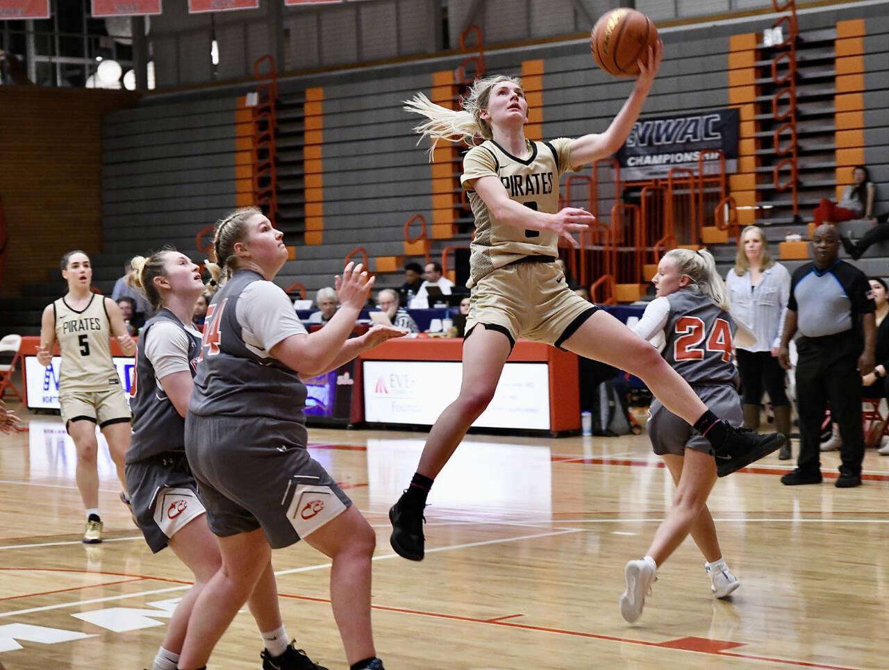 Peninsula College’s Millie Long goes up for a layup and teammate Hope Glasser watches in the background. Long scored 14 points in the fourth quarter to lead the Pirates to a 67-61 win over Clackamas in the NWAC tournament semifinals in Everett on Saturday night. (Jay Cline/Peninsula College Athletics)