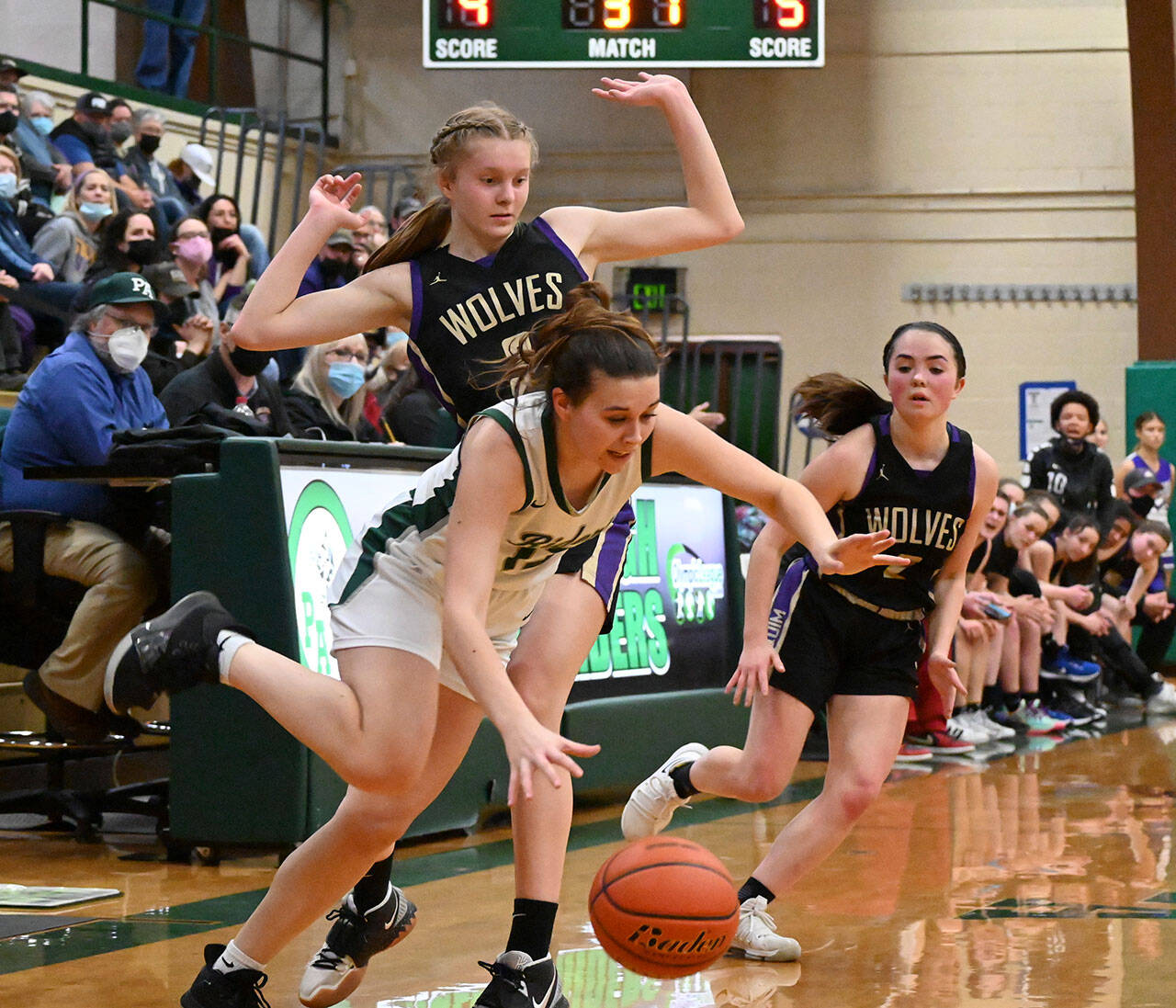 Sequim’s Jolene Vaara, left, and Hannah Bates pressure Port Angeles’ Bailee Larson in the first half of a West Central District playoff game in February in Port Angeles. All three players made the first all-Olympic girls basketball team. (Michael Dashiell/Olympic Peninsula News Group)