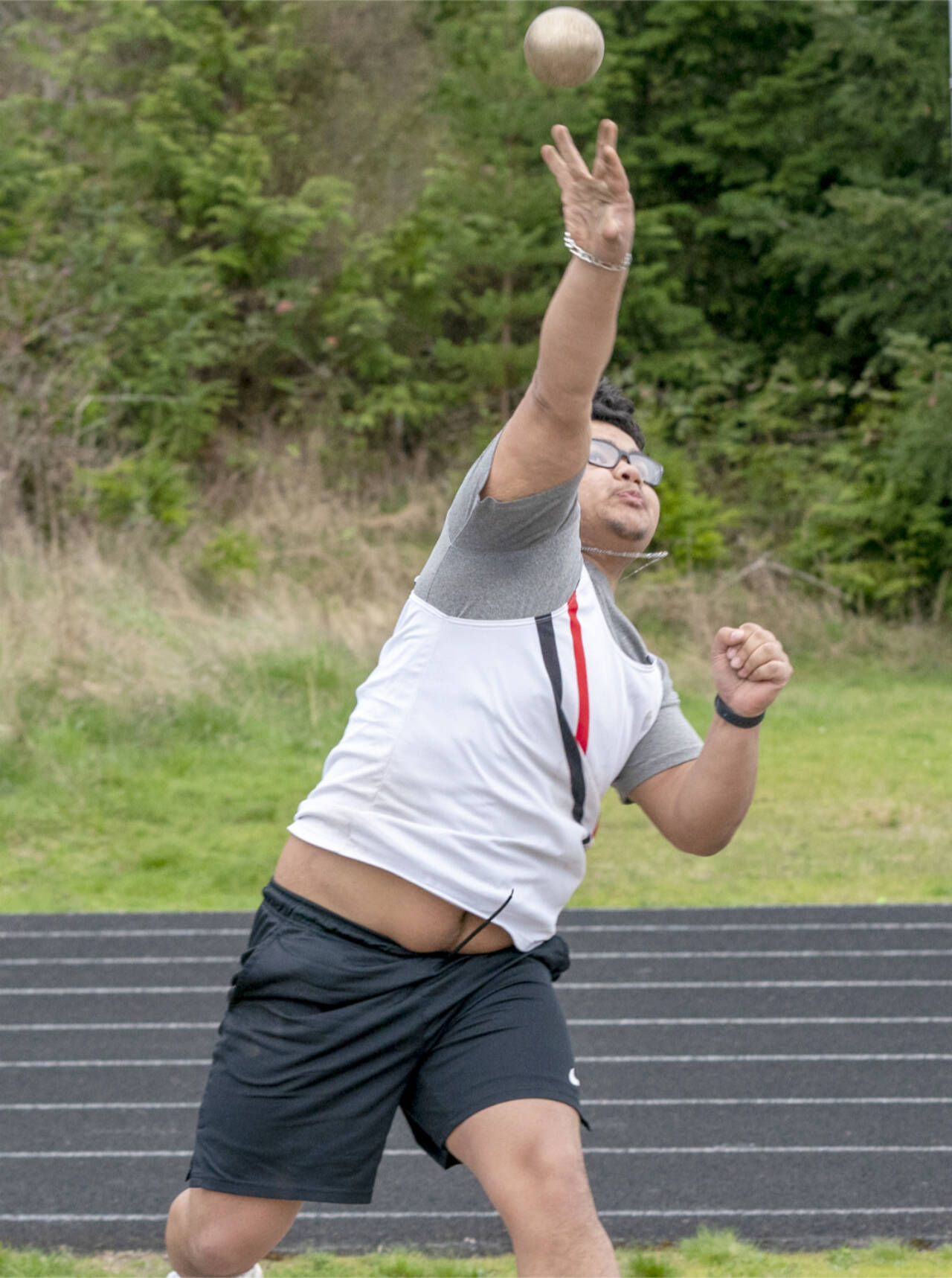 East Jefferson’s Anson Jones heaves the shot put 41 feet, 3 inches for second place in the shot put during a Nisqually League meet at Blue Heron Middle School on Tuesday. (Steve Mullensky/for Peninsula Daily News)