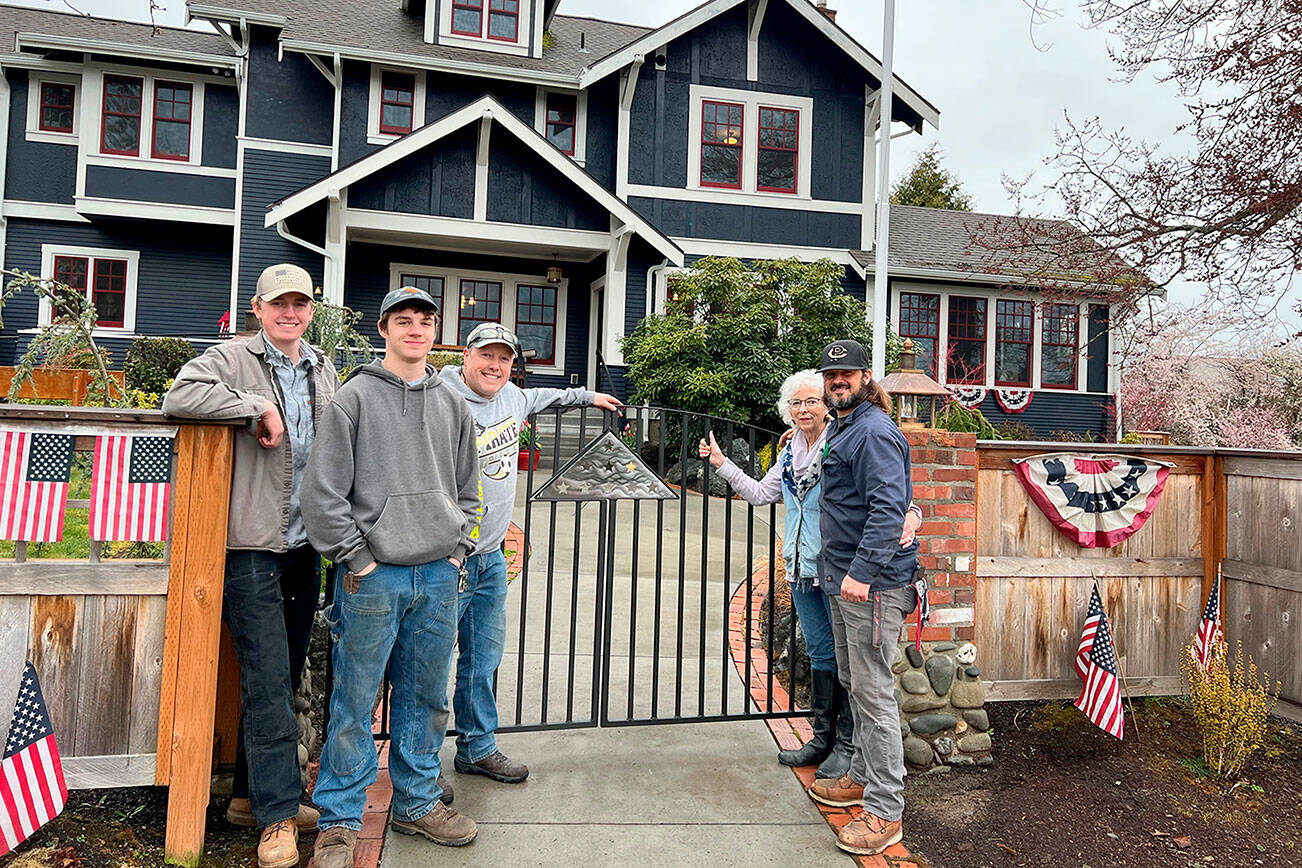 The Peninsula College welding program has fabricated a new gate for the Captain Joseph House in Port Angeles. Pictured, from left to right, are Peninsula College students Blake Parker, James Hancock, welding instructor Eoin Doherty, Betsy Reed Schultz, and welding instructor Kelly Flanagan.