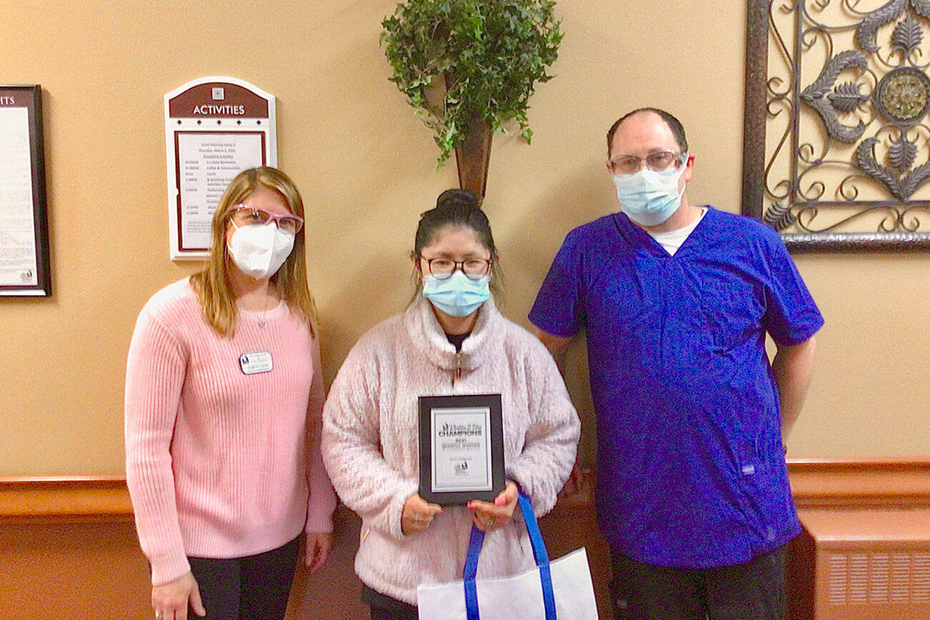 Pictured, from left to right, are Angela Cerna, executive director; Ellie Thornton; and Robert Cornell, dietary manager.