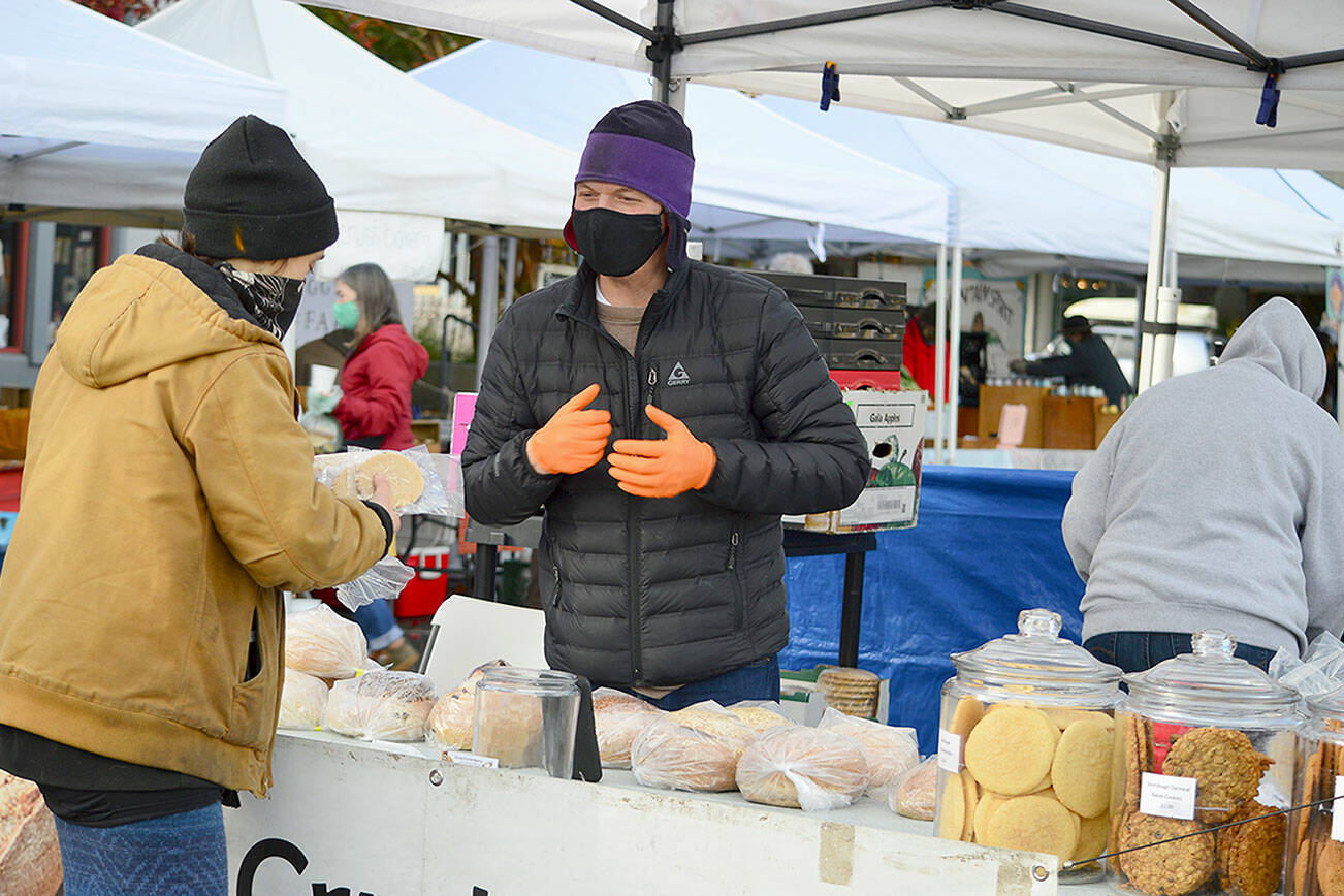 Tom Nall of Crusty Crumb Bakery, pictured in 2021, is among more than a dozen vendors of prepared foods participating this year in the Port Townsend Farmers Market, which takes over Tyler Street in the Uptown district starting this Saturday. (Diane Urbani de la Paz/Peninsula Daily News)