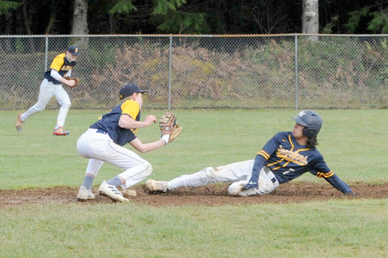 Lonnie Archibald/for Peninsula Daily News
Forks' Walker Rondeau steals second while Ilwaco's Ethan Hopkins awaits the throw during the first game of a doubleheader at Fred Orr Memorial Field in Beaver.
