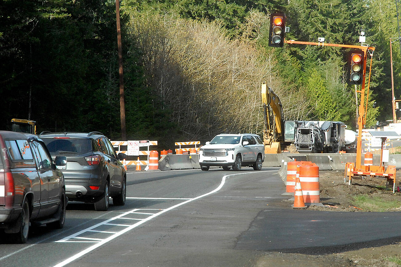 Traffic waits at a temporary stoplight controlling a one-lane temporary bridge that bypasses a construction zone on U.S. Highway 101 at Indian Creek west of Port Angeles on Saturday. (Keith Thorpe/Peninsula Daily News)