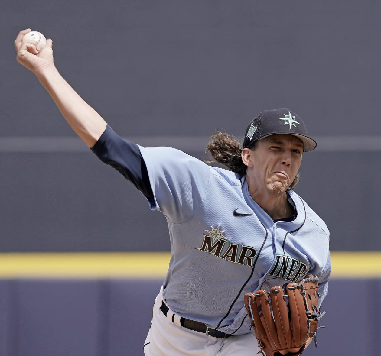 Seattle Mariners starting pitcher Logan Gilbert throws during the first inning of a spring training baseball game against the Kansas City Royals Tuesday, March 29, 2022, in Peoria, Ariz. (Charlie Riedel/The Associated Press)