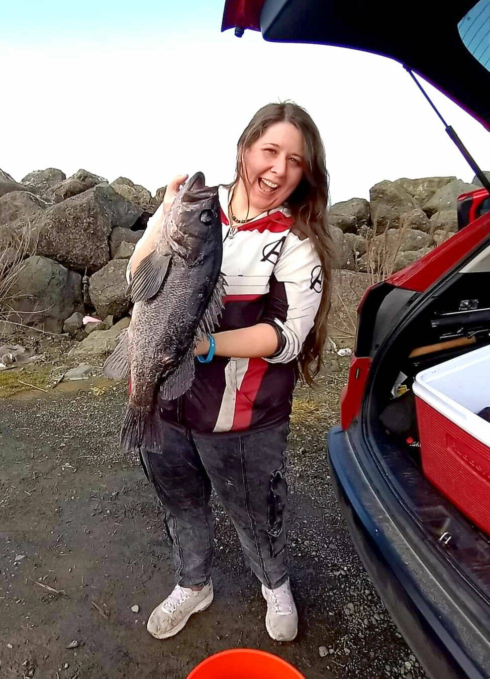 Britney Robinson found success, including this massive 24-inch black rockfish and a pair of lingcod while fishing the jetty at the Neah Bay marina recently. (Courtesy photo)