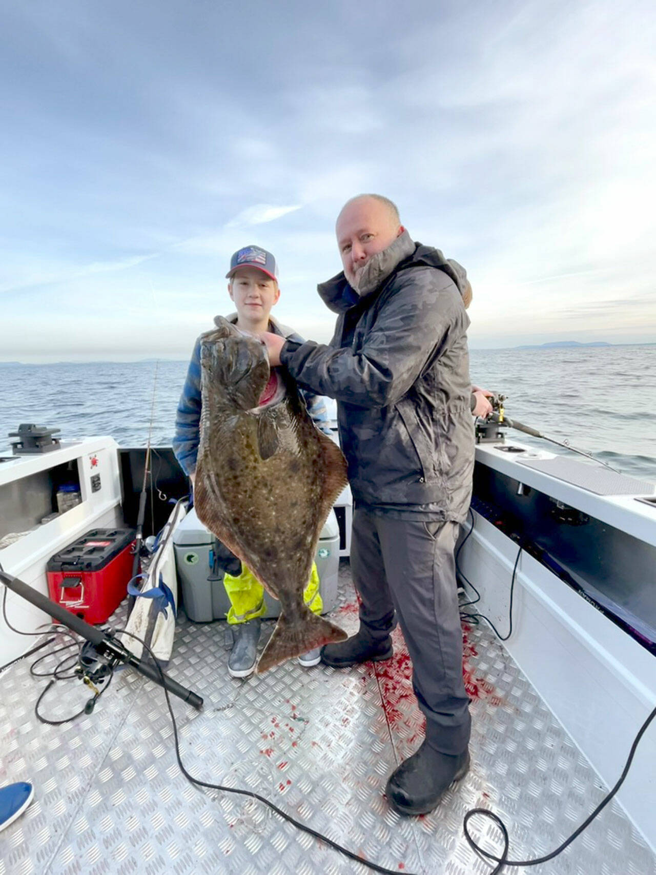 Port Ludlow’s Johnson family found success on the opening day of halibut season last week. Caleb Johnson, age 12, caught this 43-pound specimen held by his dad Jeremiah. The family planned to target lingcod on their next family fishing outing.