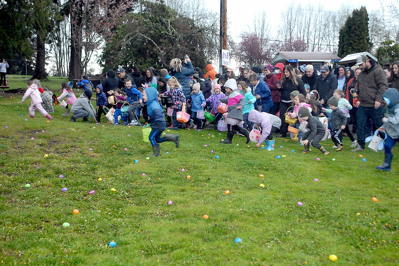Children burst from the starting area in search if treat-filled plastic eggs during Saturday’s 44th annual KONP Easter Egg Hunt at the Clallam County Fairgrounds in Port Angeles. Hundreds of children and their parents took part in the event, which also featured a visit from the Easter Bunny and a drawing for prizes. (Keith Thorpe/Peninsula Daily News)