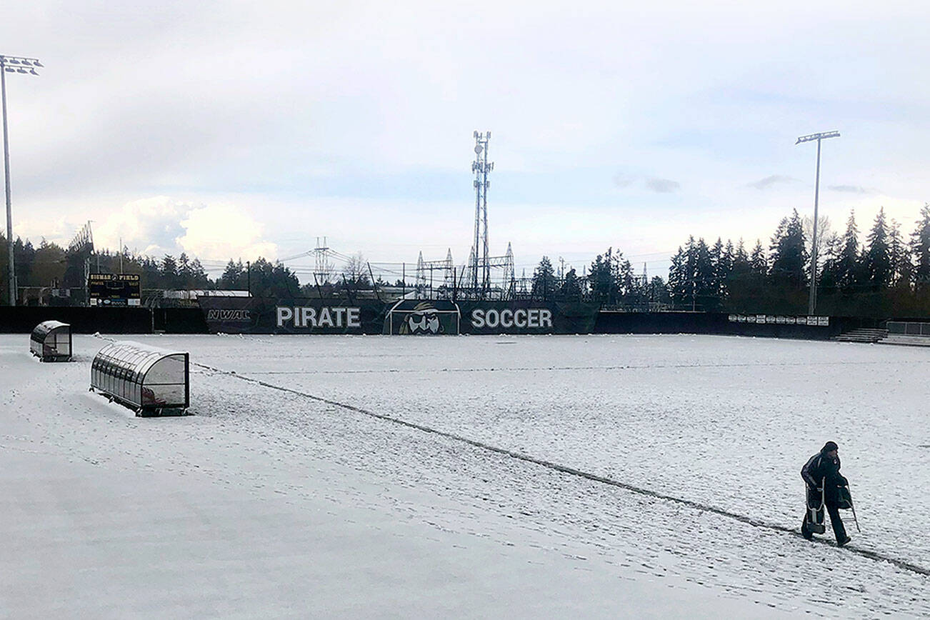Keith Thorpe/Peninsula Daily News
A thick layer of slush coats the soccer pitch at Wally Sigmar Field at Peninsula College in Port Angeles on Saturday, forcing the cancellation of JV and varsity soccer matches between Port Angeles and Bremerton. A storm that brought winter-like conditions, along with lightning and thunder, rendered the field unplayable, prompting a postponement of the games until a later date.