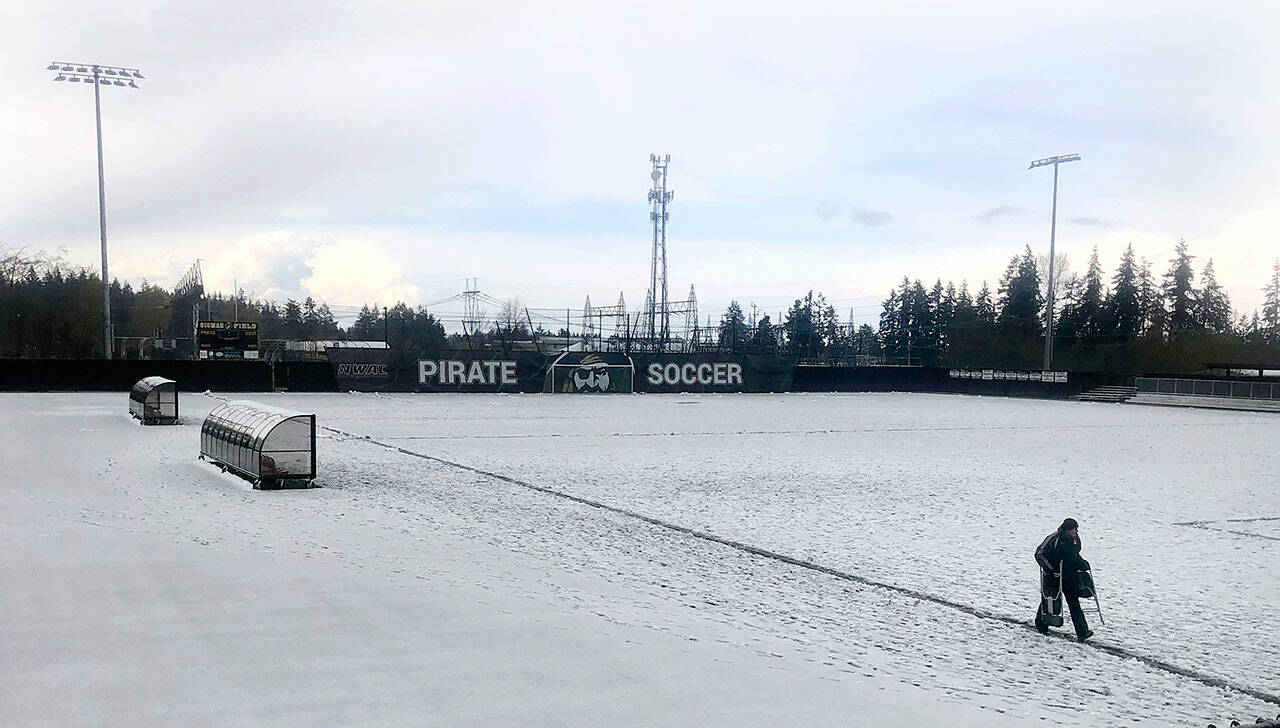 A thick layer of slush coats the soccer pitch at Wally Sigmar Field at Peninsula College in Port Angeles on Saturday, forcing the cancellation of JV and varsity soccer matches between Port Angeles and Bremerton. A storm that brought winter-like conditions, along with lightning and thunder, rendered the field unplayable, prompting a postponement of the games until a later date. (Keith Thorpe/Peninsula Daily News)