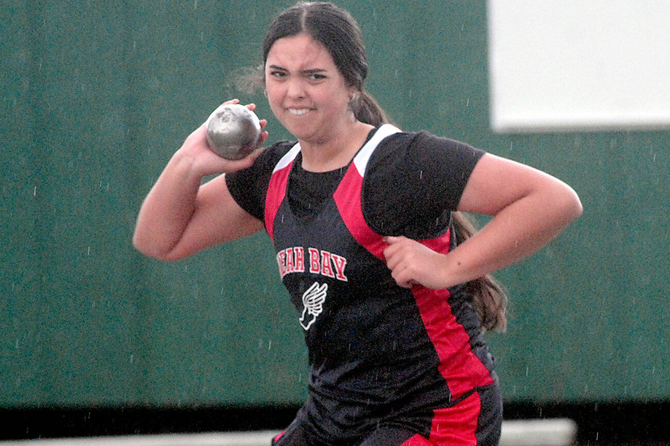Keith Thorpe/Peninsula Daily News
Neah Bay's Koren Cumming throws the shot in the girls competition on Thursday in Port Angeles.