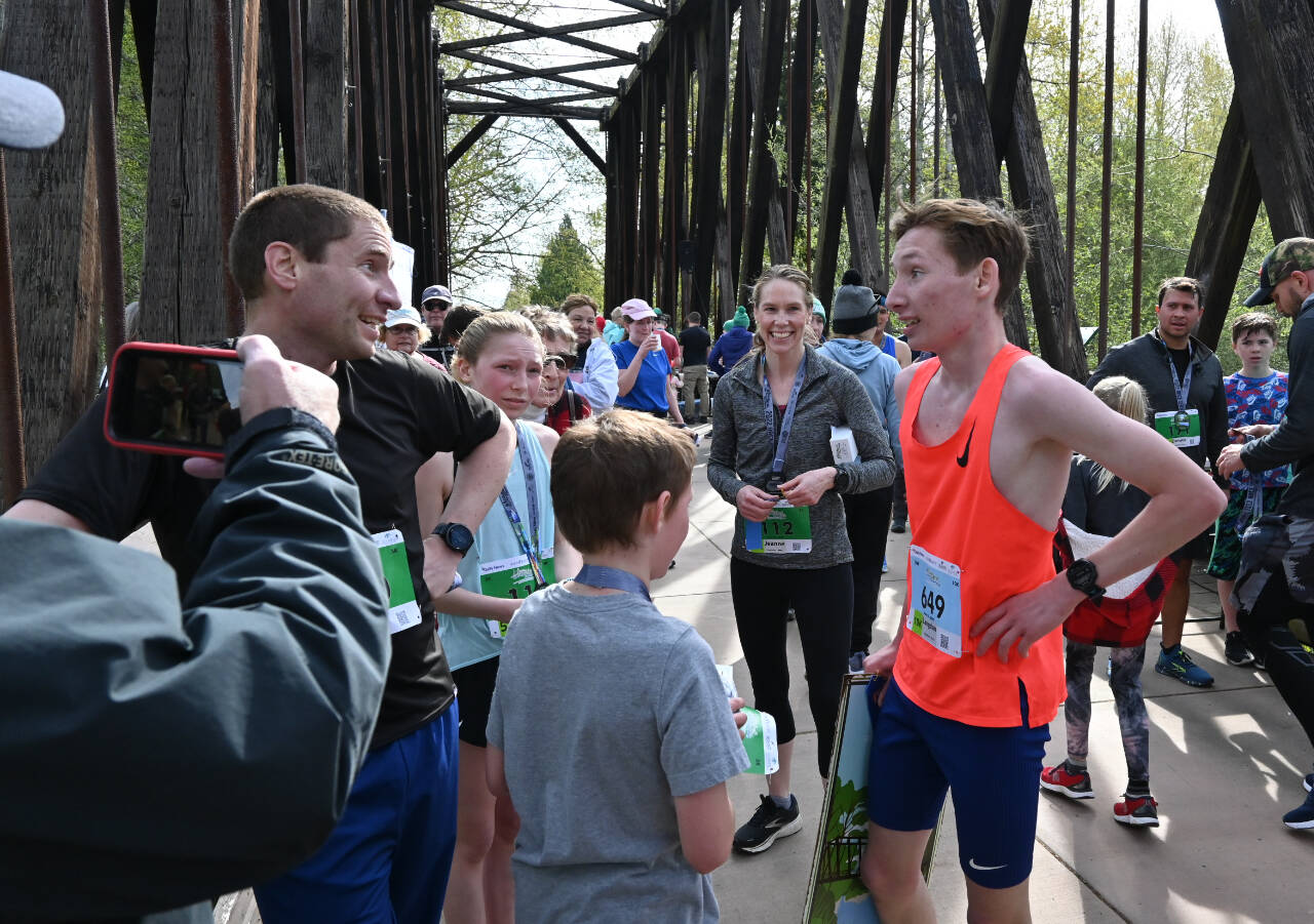 The Larson family of Port Angeles, which won the men’s 10K and the women’s 5K (and had two other top-10 finishes), talks at the finish line at the Sequim Railroad Run on Saturday. (Michael Dashiell/Olympic Peninsula News Group)