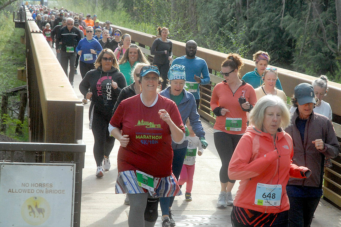 Runners take off from the start of the Railroad Bridge race of the Run the Peninsula Road Race Series on Saturday at Railroad Bridge Park in Sequim. The event, which consisted of a 5K and 10K run on the Olympic Discovery Trail, was second of the series, which also includes upcoming races on the Larry Scott Trail in Port Townsend, the Jamestown S’Klallam Reservation in Blyn and the North Olympic Discovery Marathon. (Keith Thorpe/Peninsula Daily News)