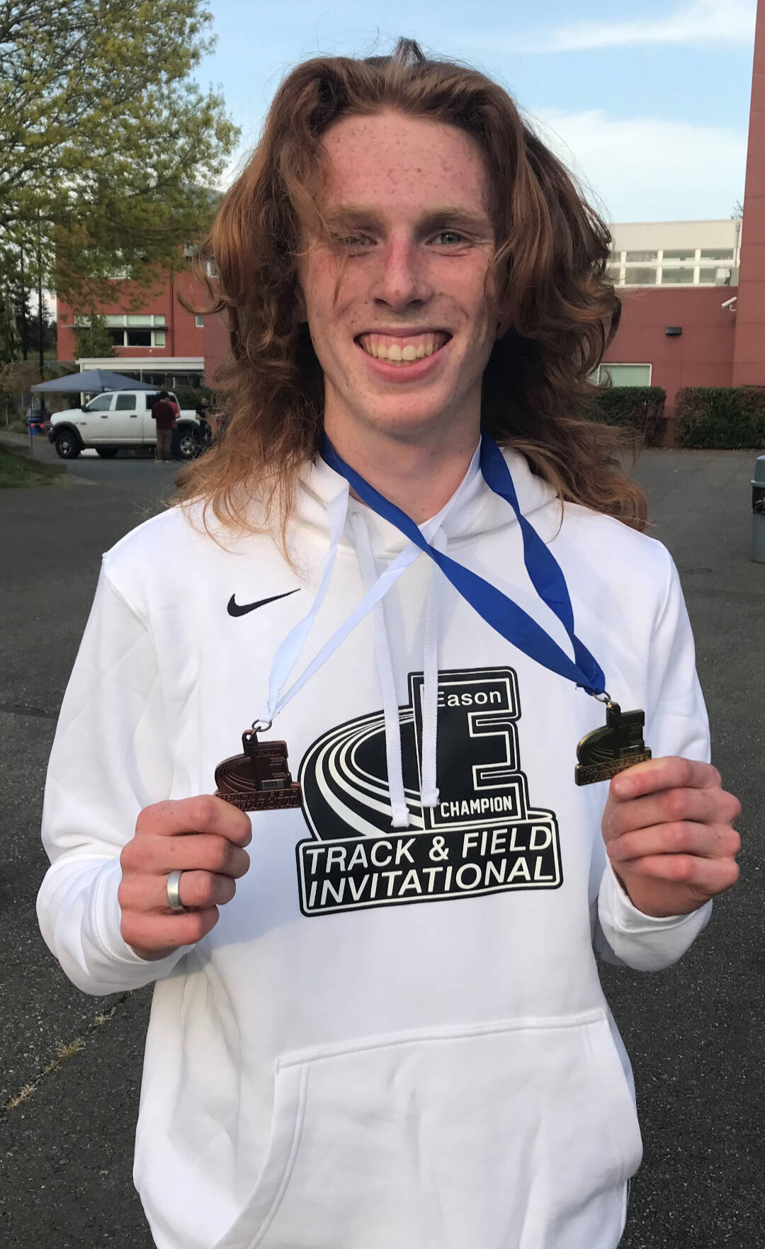 Port Angeles’ Jack Gladfelter shows off the medals he won, including a first place in the 3,200, at the Gear Up Eason Invitational held in Snohomish this weekend. Athletes from more than 50 schools competed at the meet. (Courtesy of Joe Gladfelter)