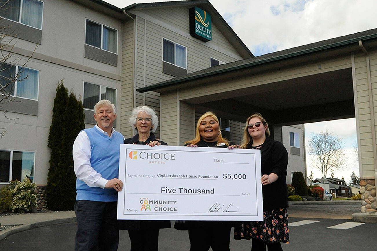 Matthew Nash/Olympic Peninsula News Group
Bret Wirta, owner of the Quality Inn and Suites in Sequim, left, with General Manager Yolanda Pompa and Kaittlyn Reese, assistant general manager, present Betsy Reed Schultz, executive director of the Captain Joseph House Foundation, second from left, $5,000 to help bring families to the Port Angeles home for respite and support. Pompa applied for the grant through the hotel's parent franchise Choice Hotels.