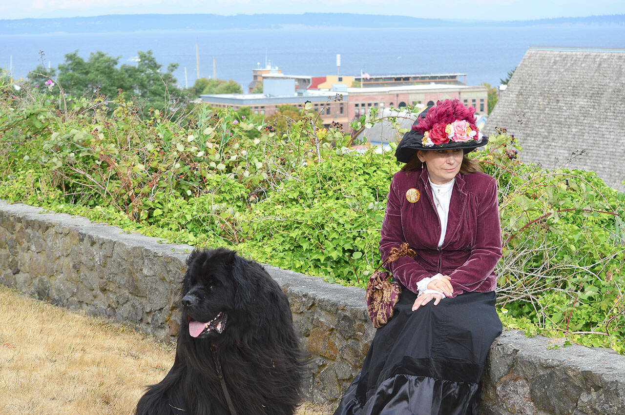 Kathy Knoblock, pictured outside Port Townsend’s Rothschild House with her constant companion Baxter, is an organizer of this weekend’s Victorian Heritage Festival. (Diane Urbani de la Paz/Peninsula Daily News)