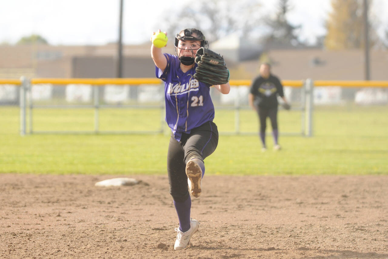 Sequim's Hannah Bates delivers a pitch against Bremerton on Tuesday. Bates pitched a complete-game two-hitter and had three hits, including a triple, for the Wolves. (Michael Dashiell/Olympic Peninsula News Group)