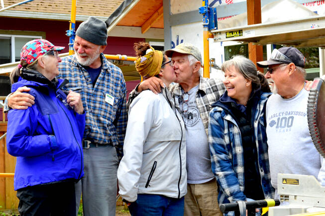 At a Habitat for Humanity job site in Port Townsend, the volunteer Care-a-Vanners — from left, Judith Noiseux and Hans Klaudt from Tucson, Ariz.; Meghan and Tom Marten of Ruidoso, N.M., and Janet and Dave Bachtel of Roseville, Calif. — take a break from construction work on Friday. (Diane Urbani de la Paz/Peninsula Daily News)