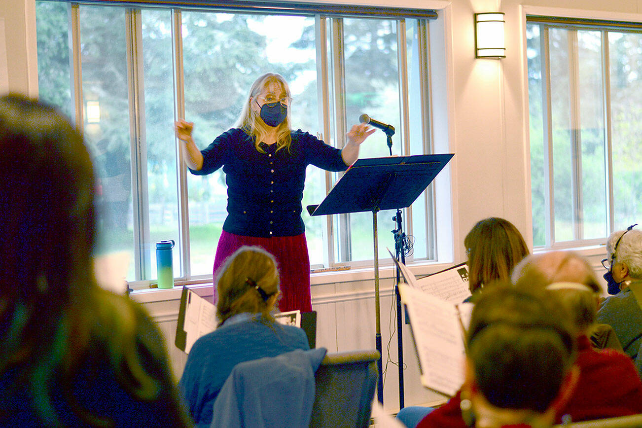 Guest conductor Jolene Dalton Gailey of Port Angeles leads the RainShadow Chorale in rehearsal for two concerts in Chimacum this week. (Diane Urbani de la Paz/Peninsula Daily News)