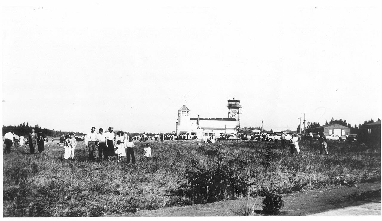 An airport fly-in in about 1946. The WPA tower is on the left, and the Army Air Corps tower is on the right. (North Olympic History Center)