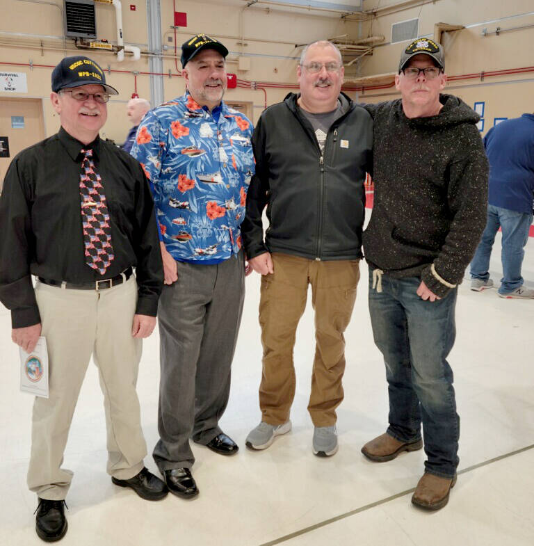 Posing at the Cuttyhunk decommissioning ceremony are, from left, Jim Robson of Poulsbo, a former commanding officer of the cutter; Jim Stoffer and Chris Robinson, both former commanding officers now living in Sequim; and Bill Gittins, who served with all three and now lives in Port Townsend. (photo by Diana Stoffer)
