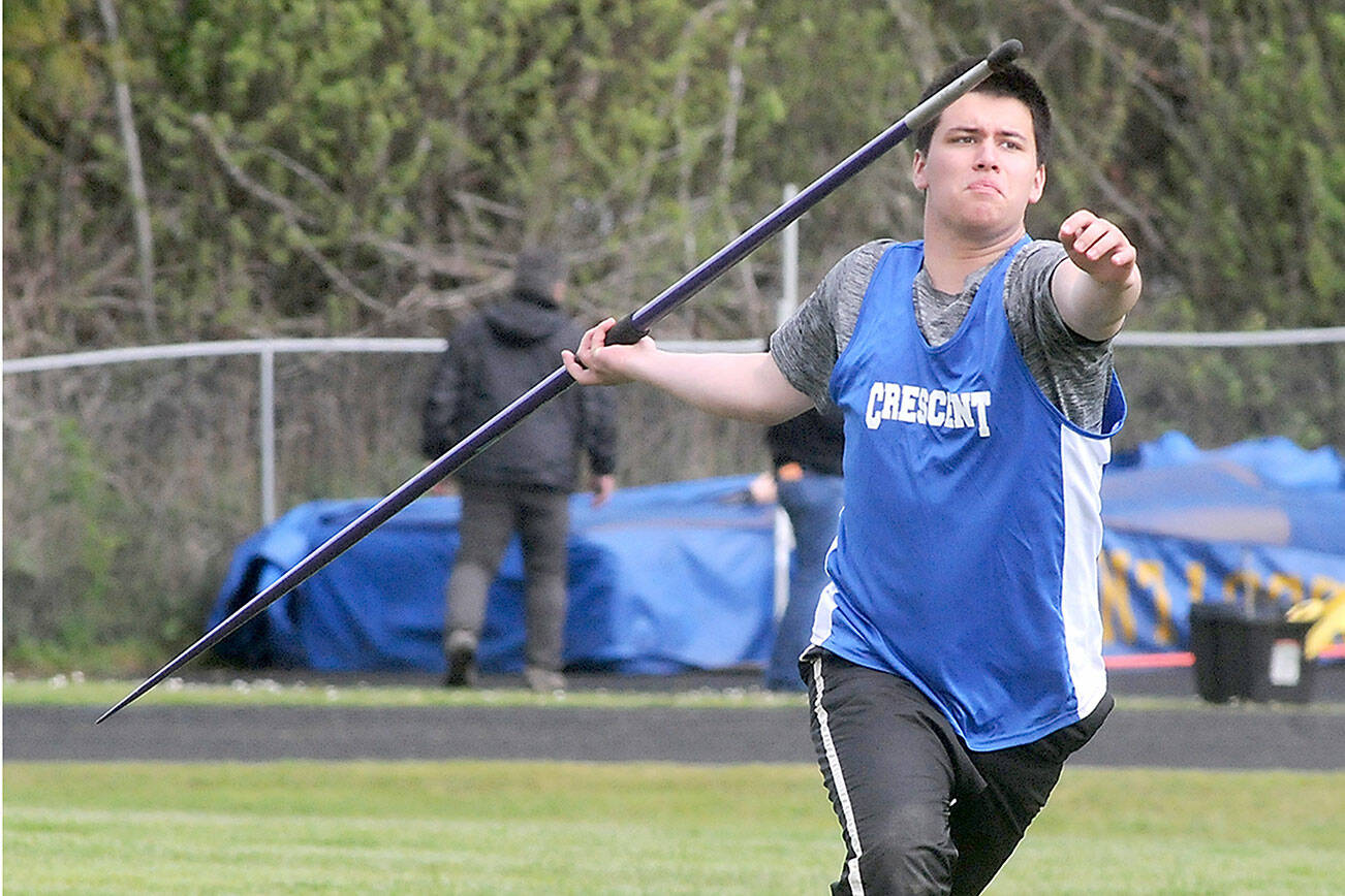 Keith Thorpe/Peninsula Daily News
Titus White of Crescent makes his run up in the javelin competition during Friday's North Olympic League championships at Crescent School in Joyce.