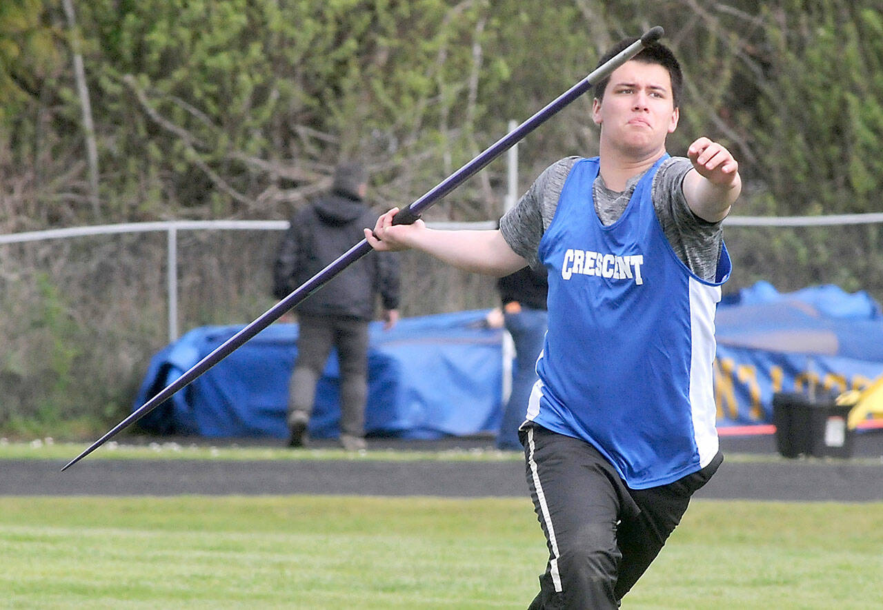 Titus White of Crescent makes his run up in the javelin competition during Fridays North Olympic League championships at Crescent School in Joyce. (Keith Thorpe/Peninsula Daily News)