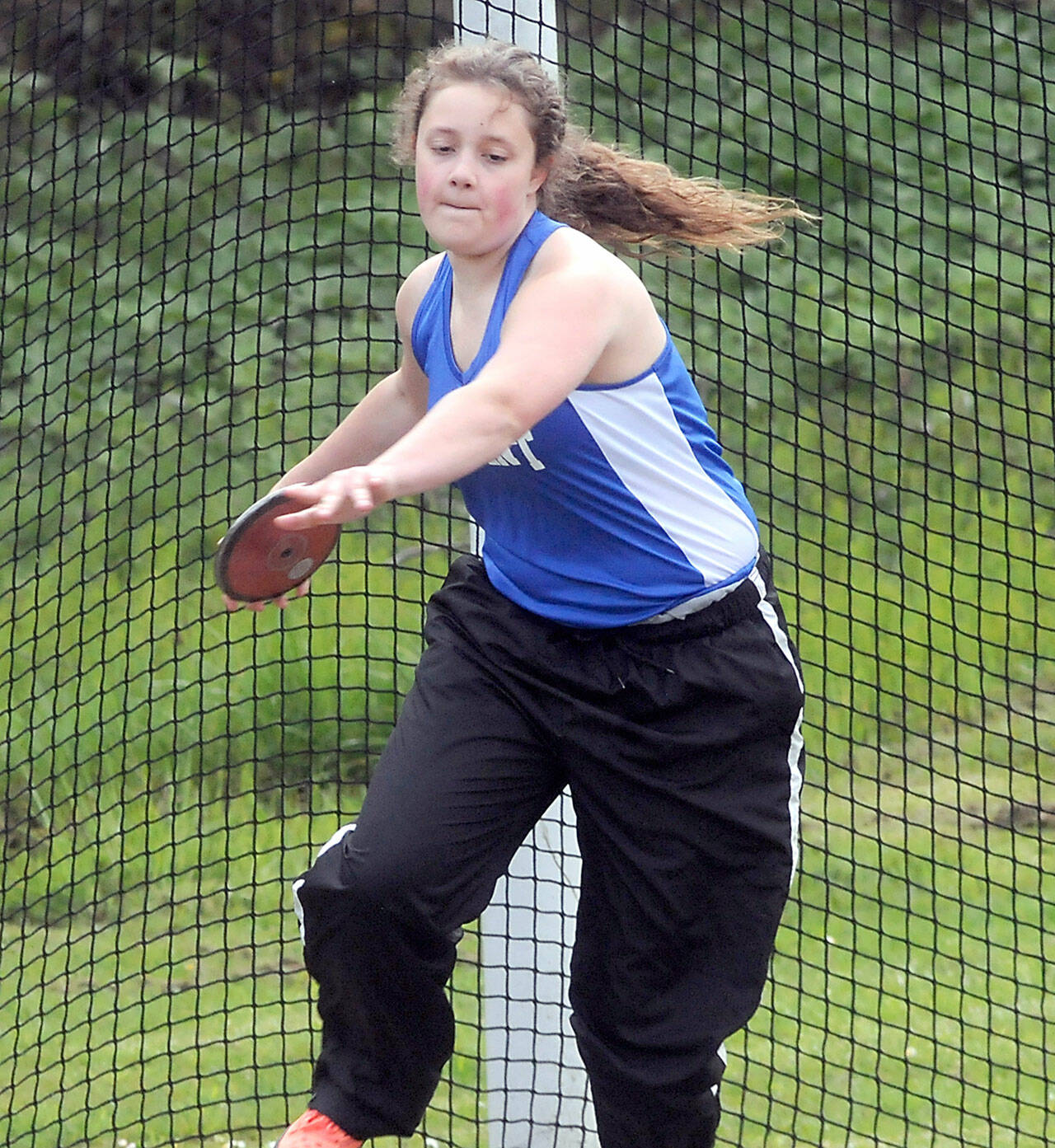 Crescent’s Katelyn Dunavant sets up to throw in Friday’s discus competition in Joyce. (Keith Thorpe/Peninsula Daily News)