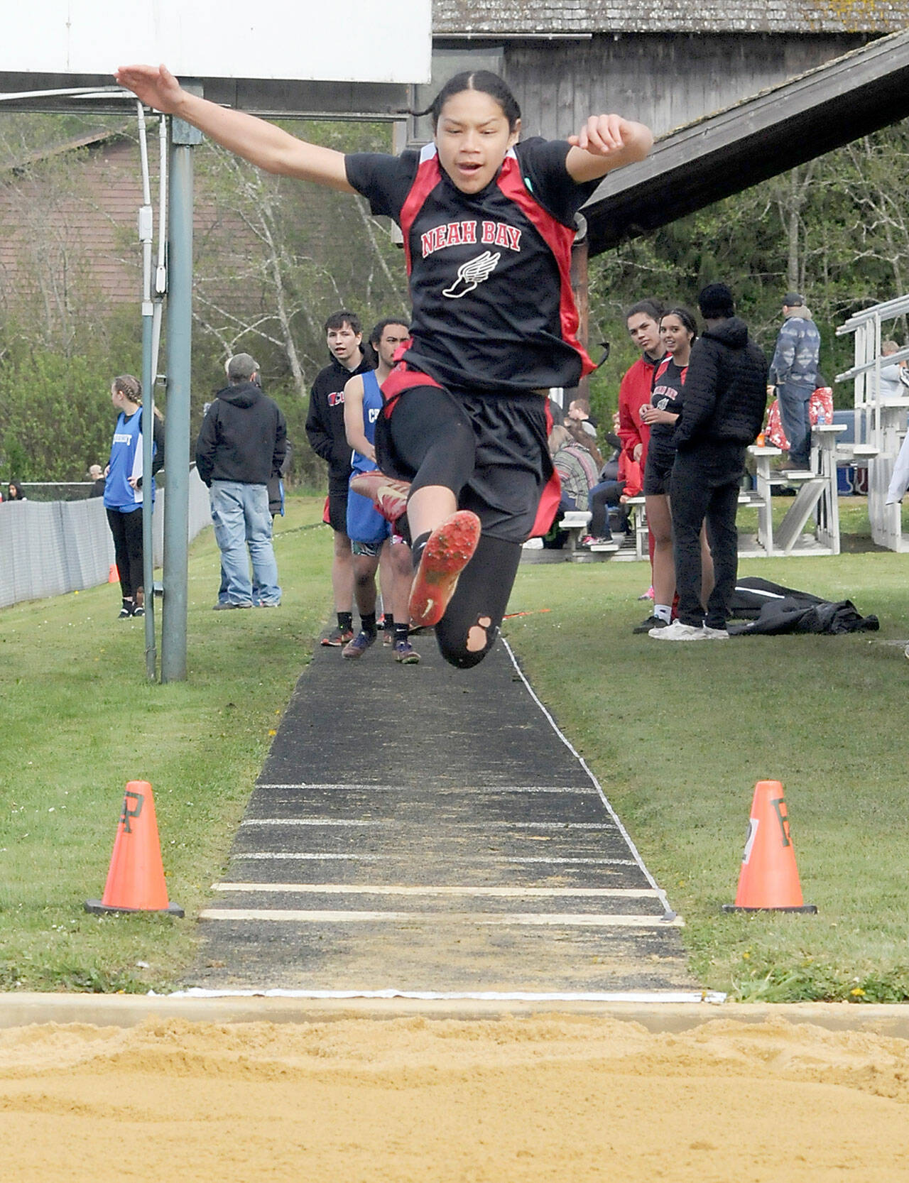 Makyah Chambers of Neah Bay leaps in the long jump on Friday in Joyce. (Keith Thorpe/Peninsula Daily News)