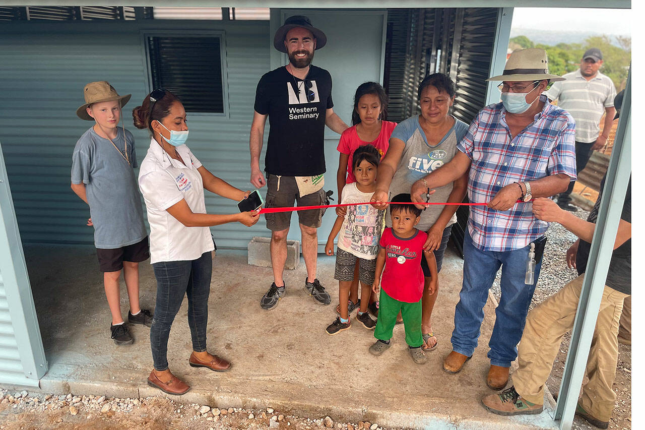 Locals hold a ribbon cutting for the new home of Margarita Chuga, second from right, and her three children. She was widowed last year, and the late-Mike Piper paid for it before his passing and his son David, third from left, wanted to help build it in Chiquimulilla, Guatemala. (Photo courtesy of David Piper)