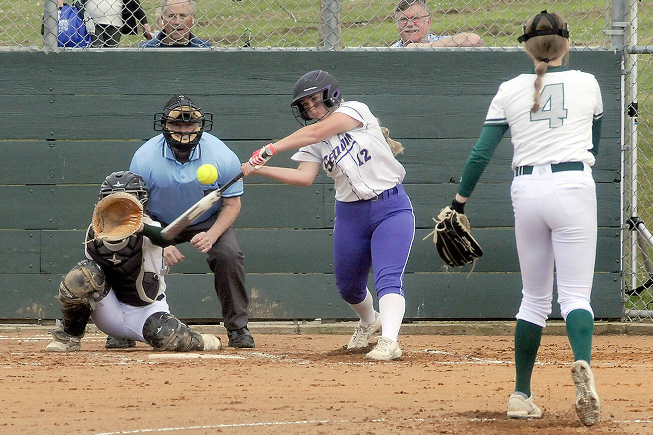 Keith Thorpe/Peninsula Daily News
Sequim's Michaela Green swings at a pitch from Port Angeles' Teagan Clark as catcher Zoe Smithson waits for the delivery on Friday in Port Angeles. Both teams will be playing at the Bi-district tournament and both teams start off one win away from qualifying for state.