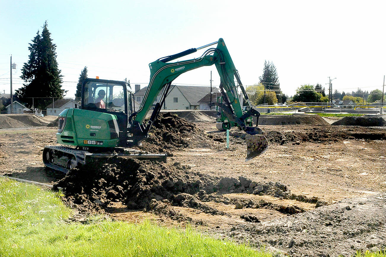 Keith Thorpe/Peninsula Daily News
An excavator moves dirt on Thursday at the site of a pump track under construction at Erickson Playfield in Port Angeles. Volunteers are sought to help with asphalt installation from May 25 to June 1.