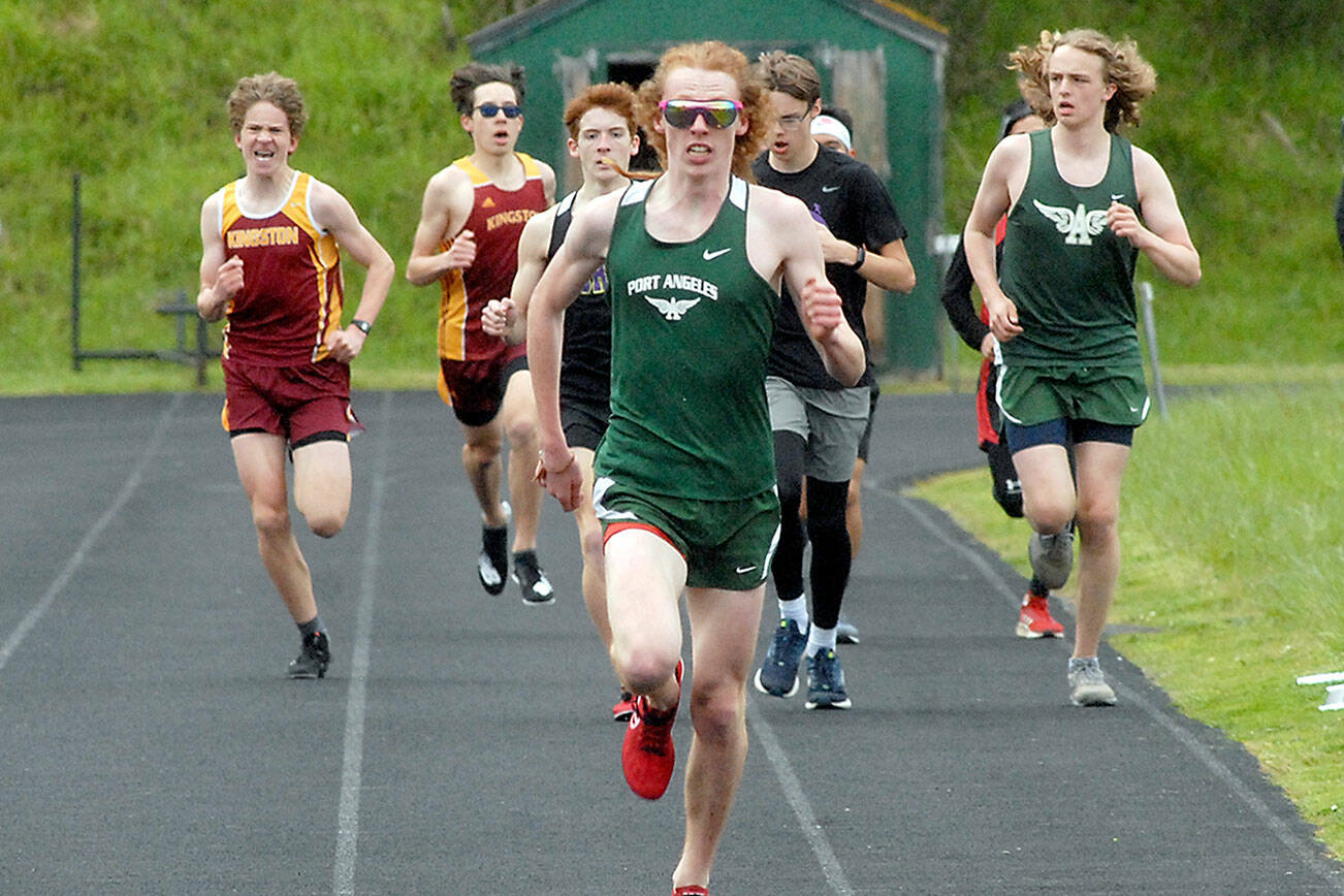 Port Angeles’ Jack Gladfelter pulls away from the pack to win the boys 1600m race on Thursday at Port Angeles High School. (Keith Thorpe/Peninsula Daily News)
