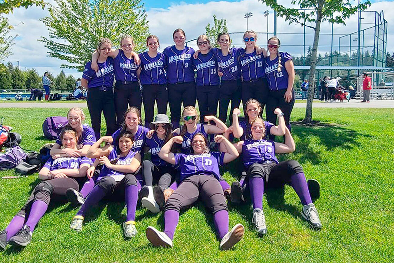 Sequim softball players relax after swamping Sammamish 21-1 in the Class 2A West Central District Softball Tournament at the RAC in Lacey. The Wolves sealed a state tournament berth with the win.