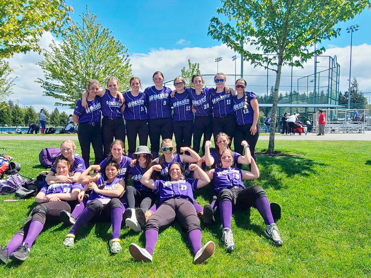 Sequim softball players relax after swamping Sammamish 21-1 in the Class 2A West Central District Softball Tournament at the RAC in Lacey. The Wolves sealed a state tournament berth with the win.