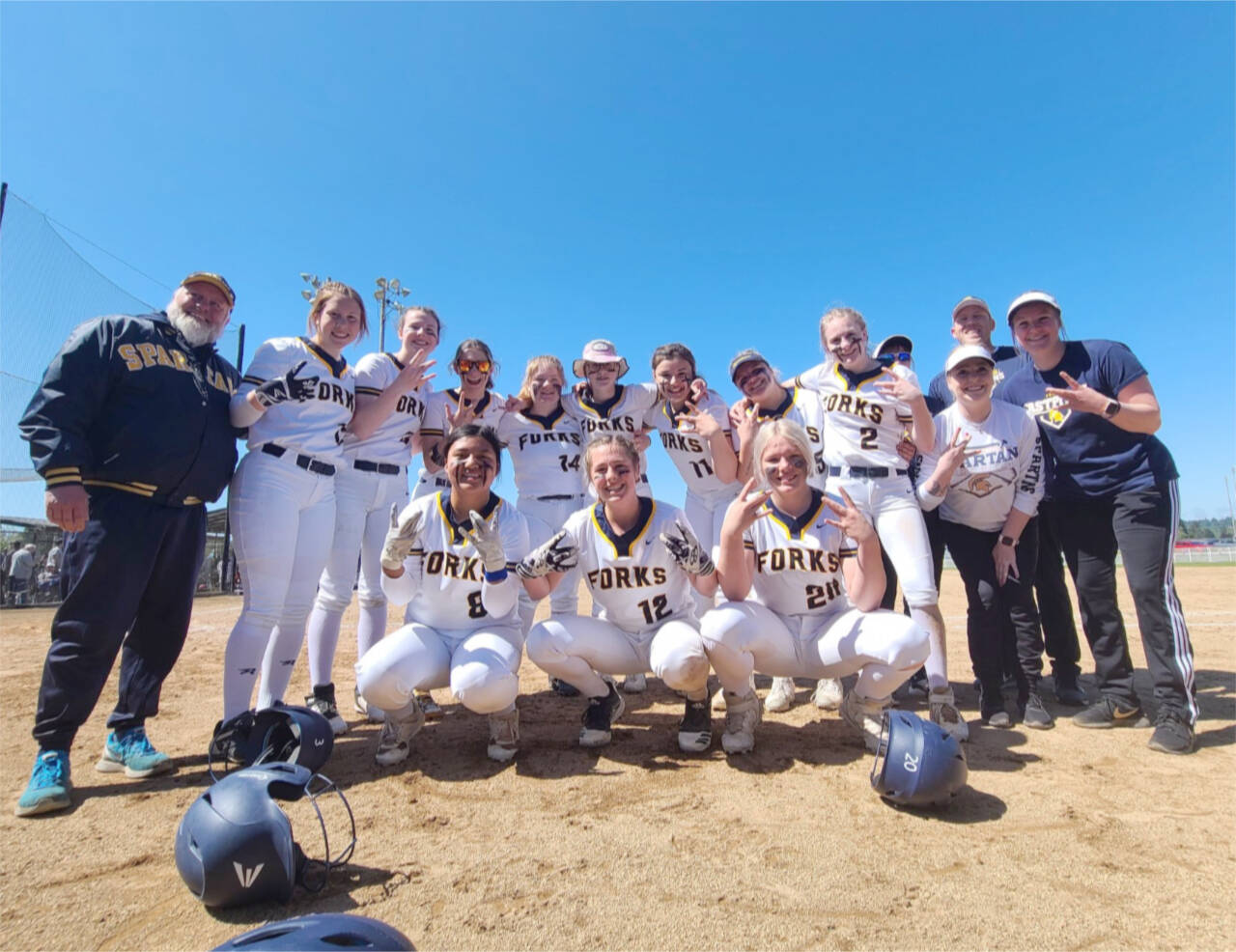 The Forks softball team celebrates representing the west side of the state and qualifying for the state 2B tournament at the Southwest 1/4 tournament this weekend. (Courtesy photo)