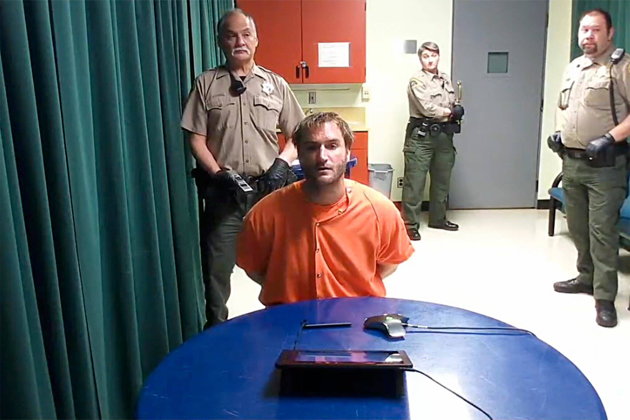 Bret Allen Kenney, 34, appears in Clallam County Superior Court on May 24 via video to be formally charged with attempted second-degree murder, assault on a police officer, disarming a police officer and driving under the influence of drugs. His bail was revoked and his arraignment is set for June 3.