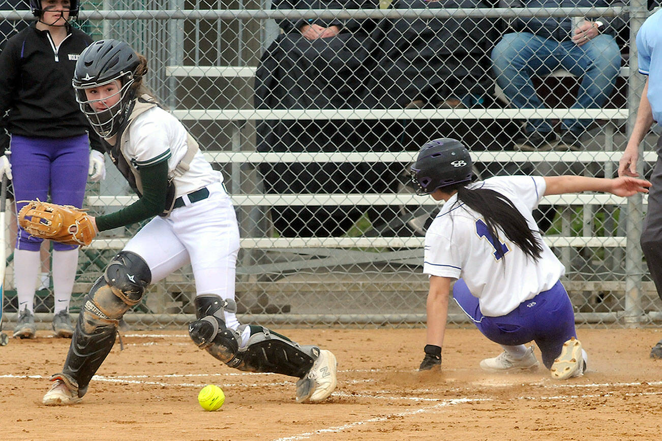 Keith Thorpe/Peninsula Daily News
Port Angeles catcher Zoe Smithson, left, was named the Olympic League MVP for the second year in a row. At right is Sequim's Taylee Rome, whol made the all-league second team.