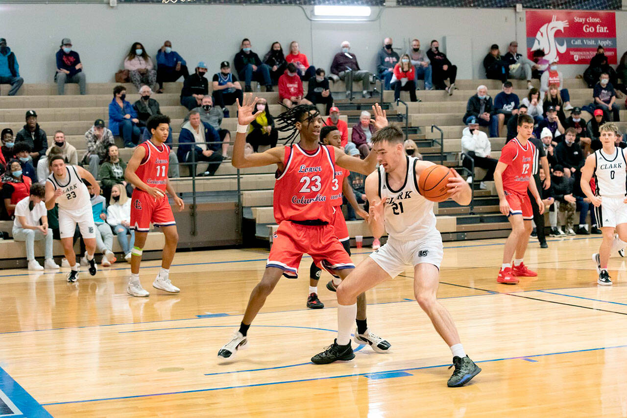 Clark Colleges Liam Clark, right, a 2019 Port Angeles High School graduate, has signed a letter of intent to play basketball at Western Washington University. Clark averaged 15.6 points and 8.3 rebounds on 65.6-percent shooting from the field this season for the Penguins. (Clark College Athletics)