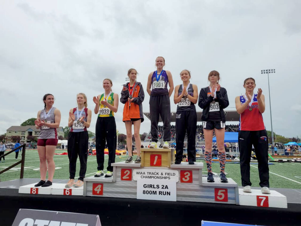 Sequim's Riley Pyeatt receives her medal for winning the state championship in the 800-meter run Saturday at the 2A state track and field championships held at Mount Tahoma Stadium. (Michael Dashiell/Olympic Peninsula News Group)