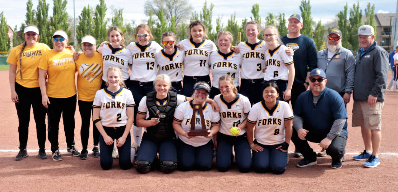 The Forks softball team celebrates its third-place trophy at the state 2B tournament held in Yakima this weekend. (Roger Harnack/Free Press Publishing)