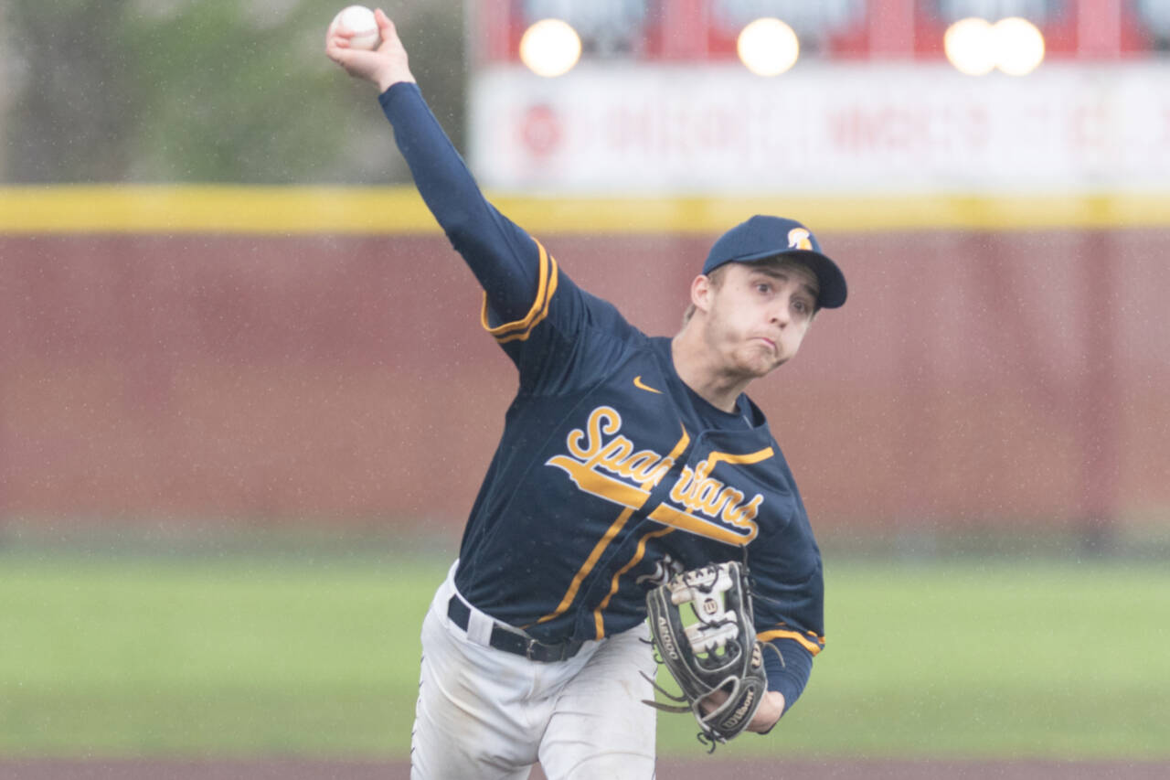Forks pitcher Logan Olson releases a pitch against Adna in the District 4 quarterfinals at Shelton High School on May 7. Olson was named the Pacific 2B League baseball MVP. (Alec Dietz/The Daily Chronicle)