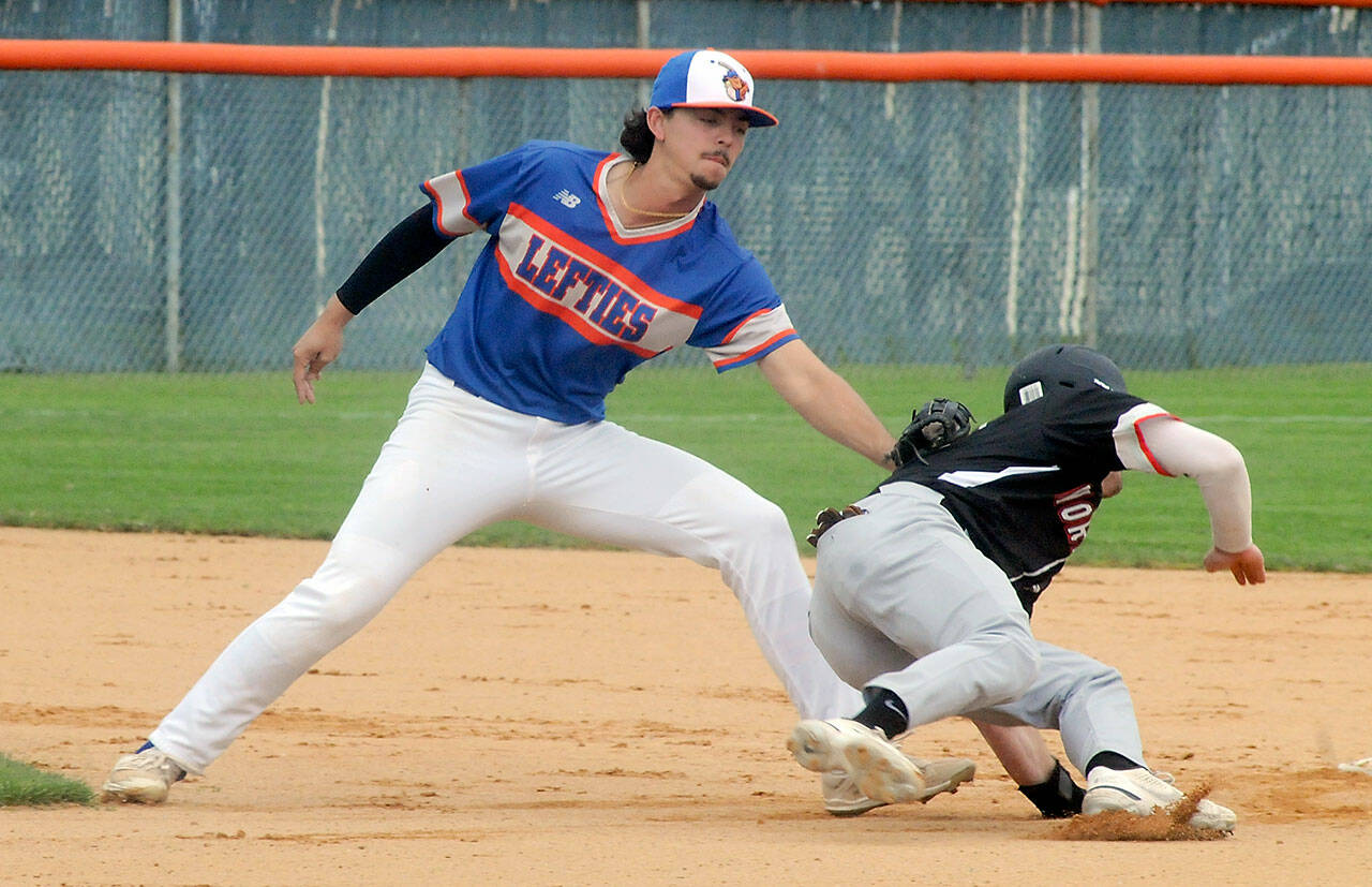 Lefties shortstop Riley Parker tags out Kamloops baserunner Tommy Green during a steal attempt in the second inning of the first game of Saturdays double header in Port Angeles. (Keith Thorpe/Peninsula Daily News)