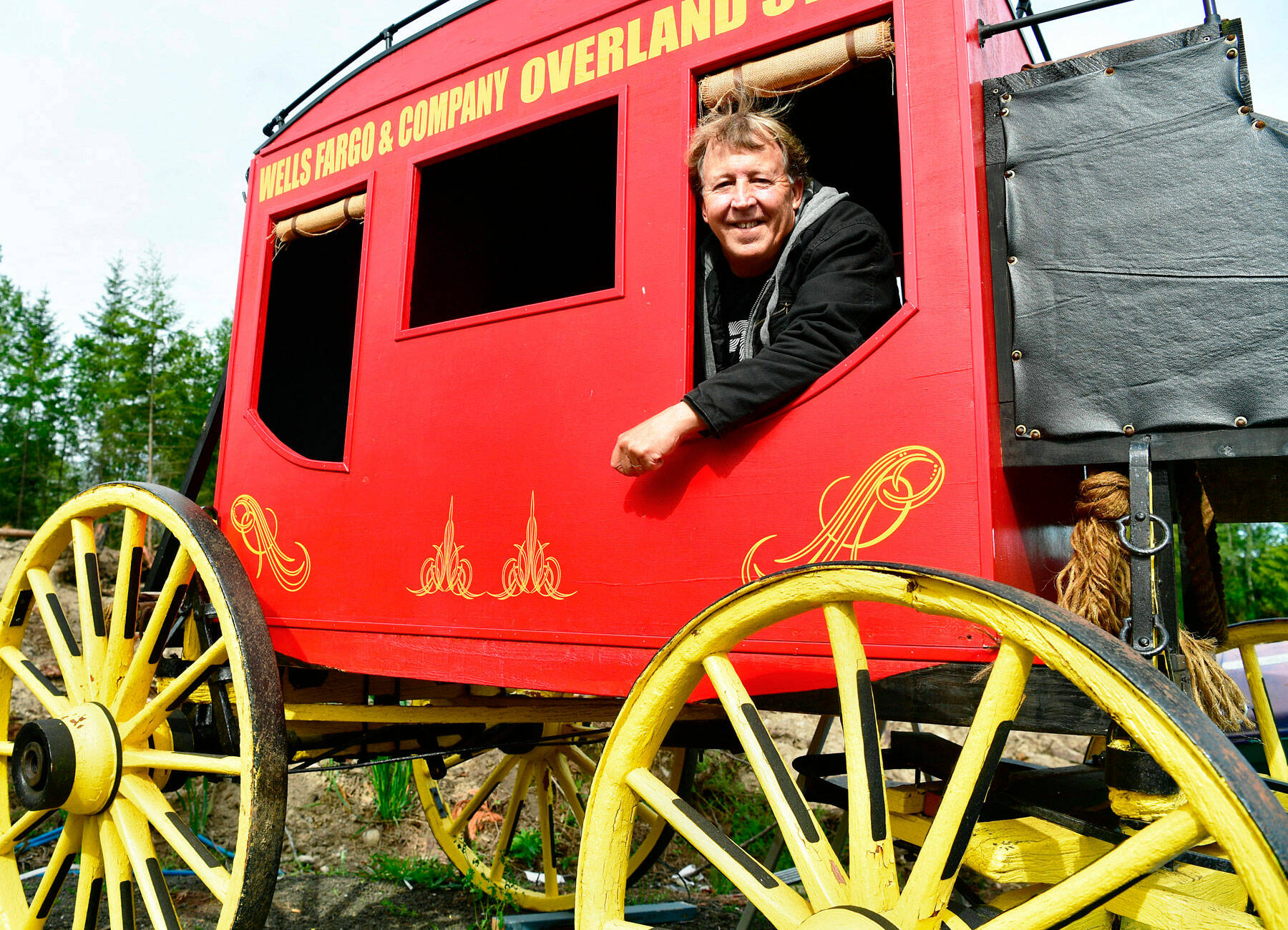 Paul Dunn / Peninsula Daily News
Richard Moon built this stagecoach after locating the wheels online. The coach will adorn an Old West-themed hole.