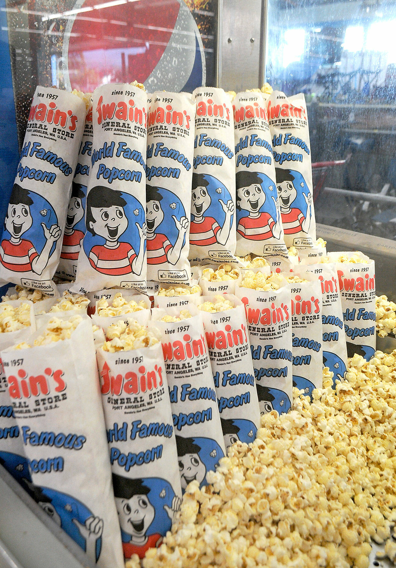 Bags of Swain’s popcorn wait as a salty snack for customers as popcorn sales resumed on Wednesday. (Keith Thorpe/Peninsula Daily News)