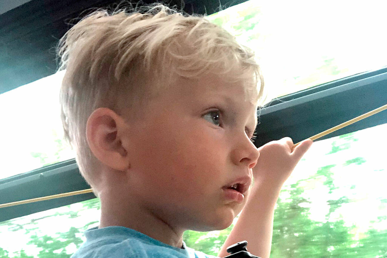 Makee Lahti Locklear, 3, rides a Jefferson Transit bus during Car Free Day. He rode with his mother to a gymnastics class.