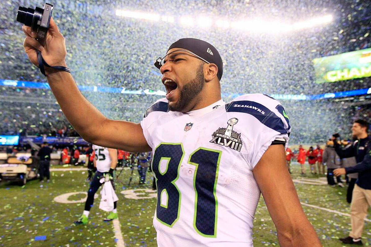 The Associated Press
Golden Tate celebrates after the Seattle Seahawks won Super Bowl XLVIII in 2014. Tate, who also played baseball in college at Notre Dame, will play for the Port Angeles Lefties tonight at Civic Field.
